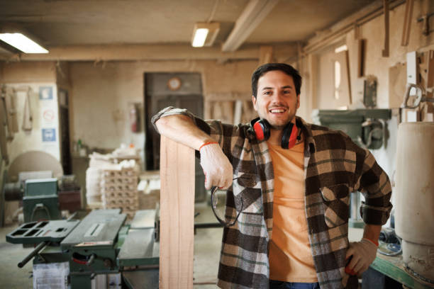 istock Portrait of young handsome carpenter in a workshop 1441732667