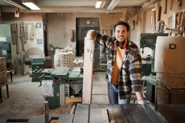 istock Portrait of young handsome carpenter in a workshop 1441732675