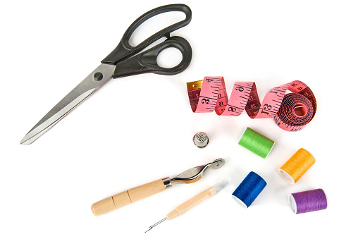 Set of sewing accessories isolated on white background.