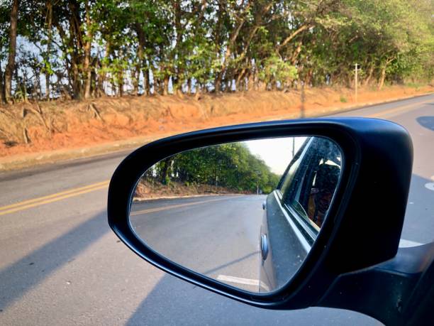 istock Looking through the rearview mirror on a street without much traffic 1441738372