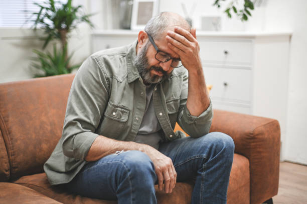 istock mature adult man in home interior ( negative emotion) 1441738383