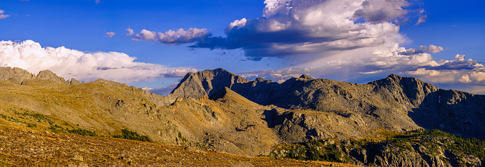 Alpine Lake Mountain Landscape in Summer - Scenic high alpine area with mountain peaks and clear blue lake on sunny day. Beauty in nature tranquil scene.