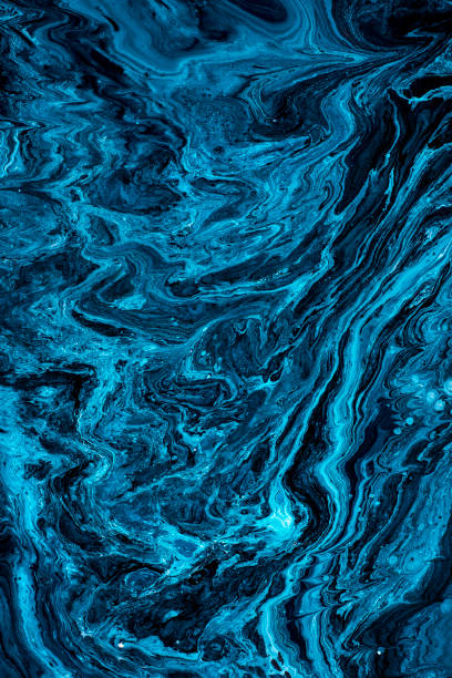 istock Free Flowing Blue and Black Acrylic Paint 1441743203