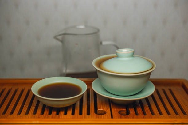 istock Brewing Chinese tea in ceramic gaiwan during the tea ceremony close-up. 1441745515
