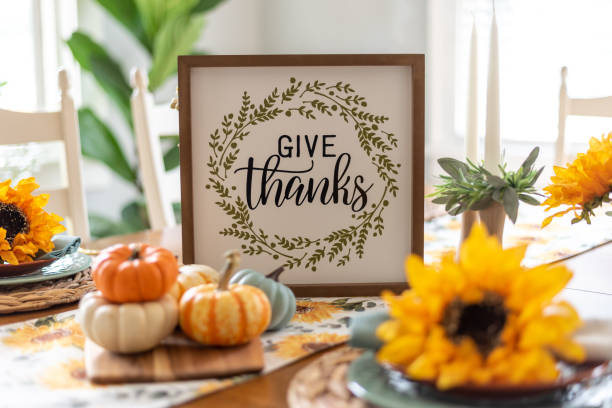 istock Thanksgiving table decorated with a sign that says Give thanks 1441747356