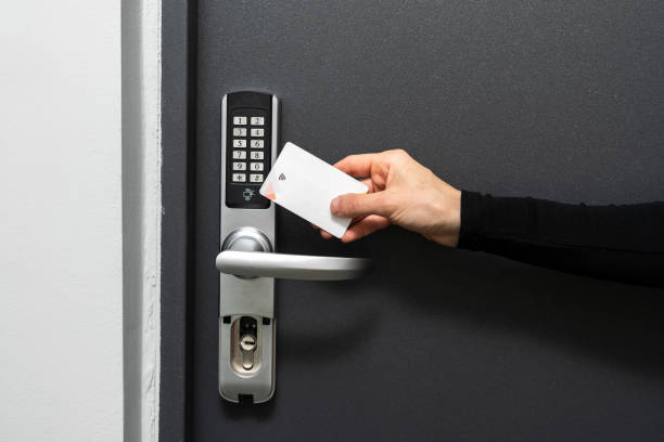 istock Woman using plastic card to opened hotel room 1441748053