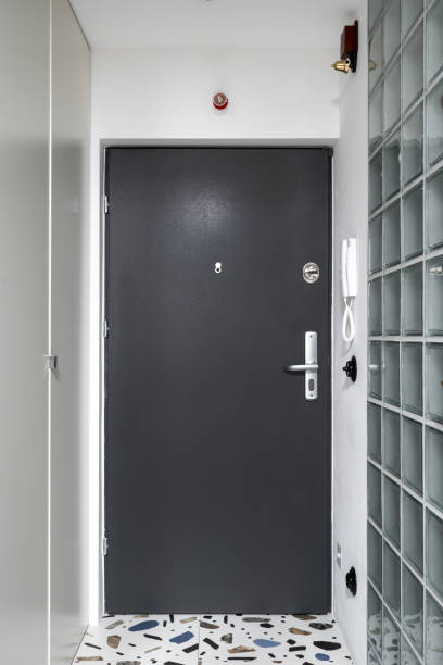 istock Metal door, intercom and wardrobe for outerwear in hallway 1441748078