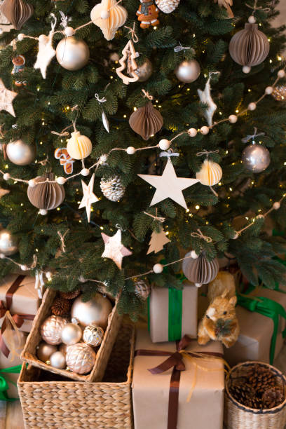 istock Christmas tree and gifts in home interior 1441748785