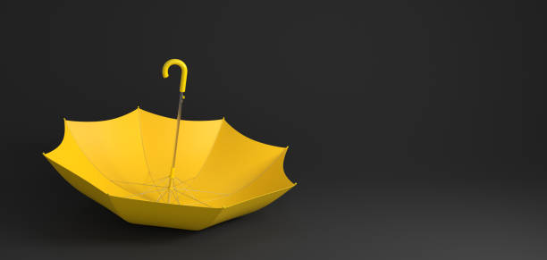istock Yellow umbrella lying upside down on black background. 3d rendered image. 1441749769