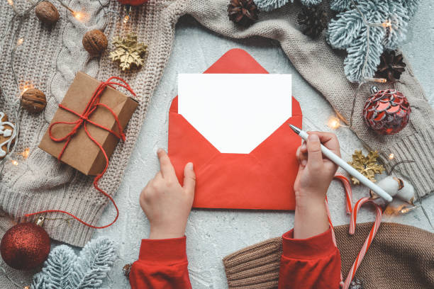 istock New Year's envelope with a letter in hands with a place for your text 1441751462