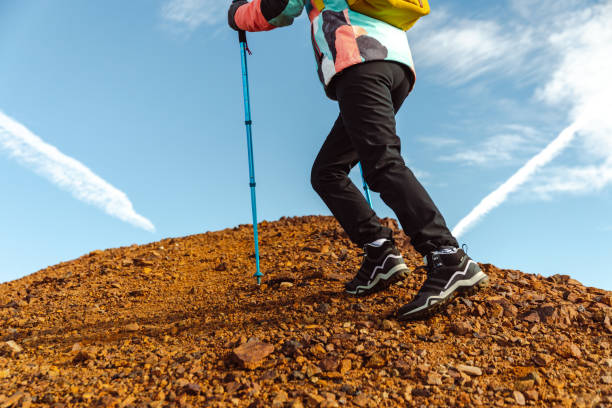 istock A female hiker walks towards a mountain peak 1441755097