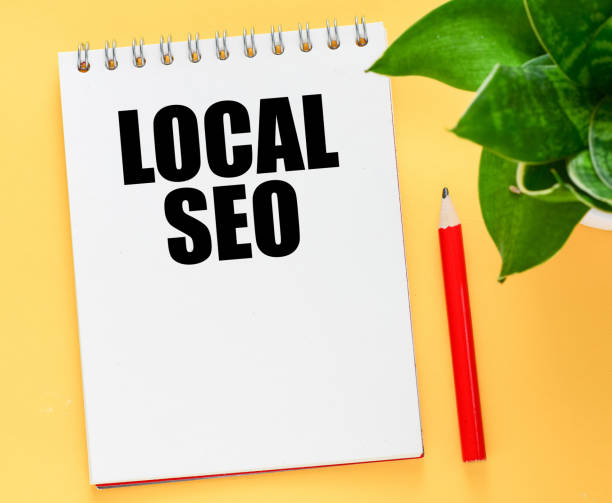 istock LOCAL SEO word in notebook on yellow background. 1441756029