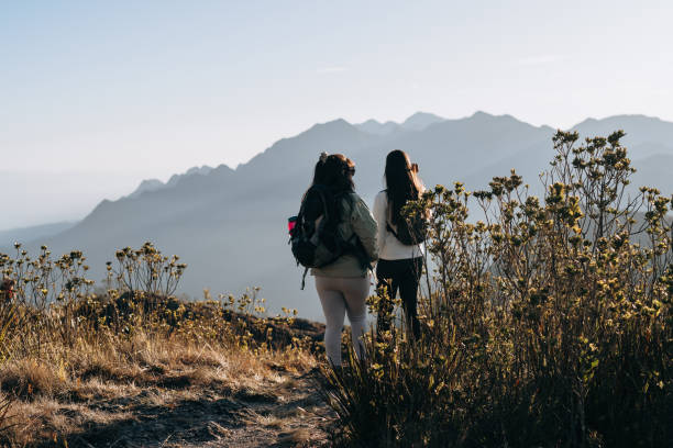 istock Women backpackers on the trail to the mountains 1441761829