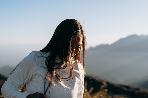 Long hair woman in the mountains
