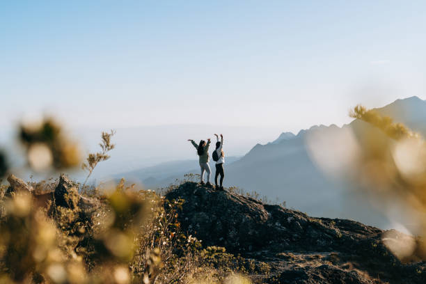 istock Women with open arms on the mountain 1441762486