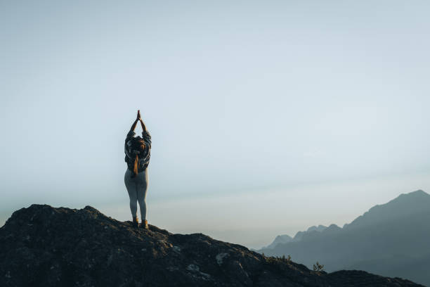 istock Woman during relaxation exercise in the mountain 1441762721