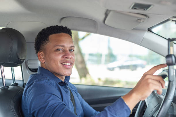 istock Portrait of young male driver using mobile app 1441762908