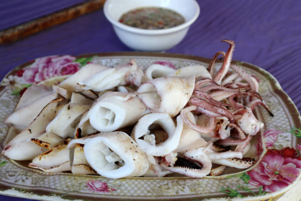 istock Grilled Squid with spicy sauce in Thai style. 1441763165
