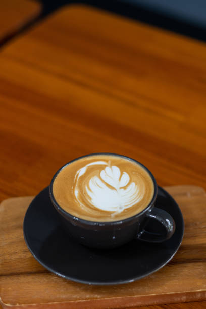istock hot latte art coffee on wood table, relax time 1441766279