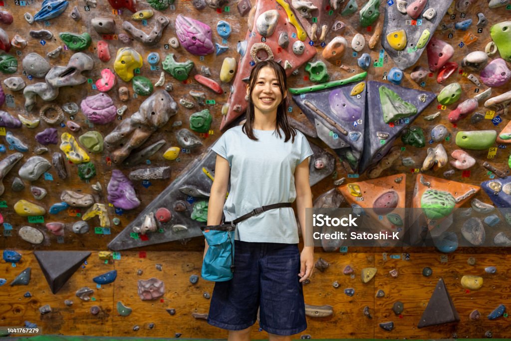Portrait of female bouldering athlete - three quarter length One Woman Only Stock Photo