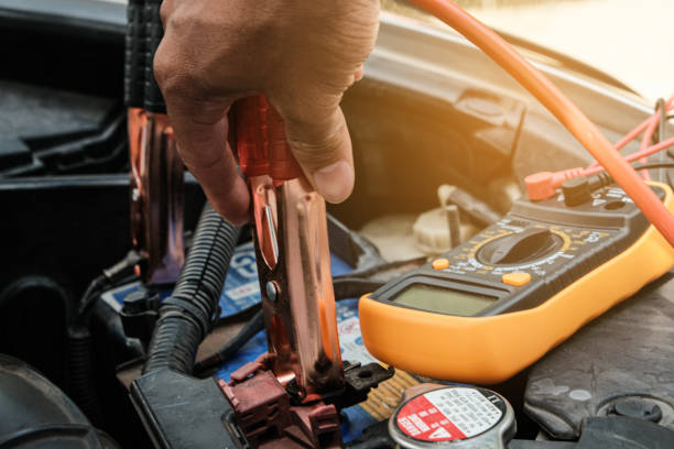 istock Mechanic hand use multimeter voltmeter to check the voltage level 1441768098