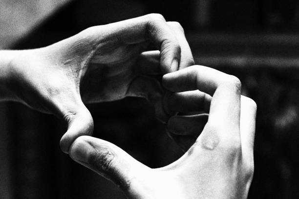 istock Child Making Heart Shape with his Hands. Monochromatic Black and White Tones 1441770014