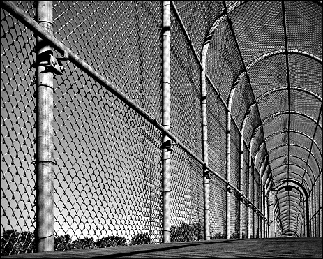 Taken in Regina, Saskatchewan. Black and white photo of a footbridge that goes over a highway/expressway