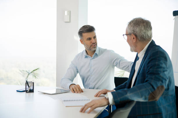 istock Office colleagues having casual discussion 1441771647