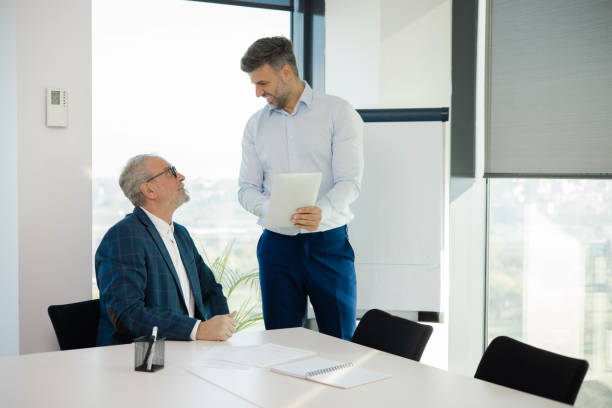 istock Office colleagues having casual discussion 1441771680