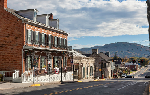 A view of the town of Bedford , Pennsylvania  with the Wills Mountain Range in the background.