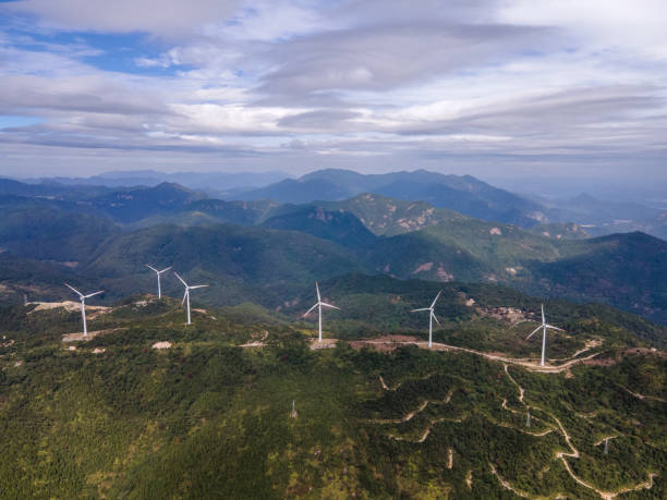 istock Bird's eye view of a wind generator on a mountain 1441772618
