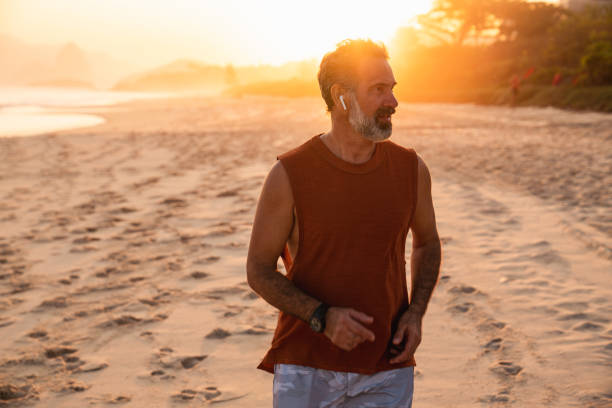 istock An active senior enjoys jogging on the beach 1441774423