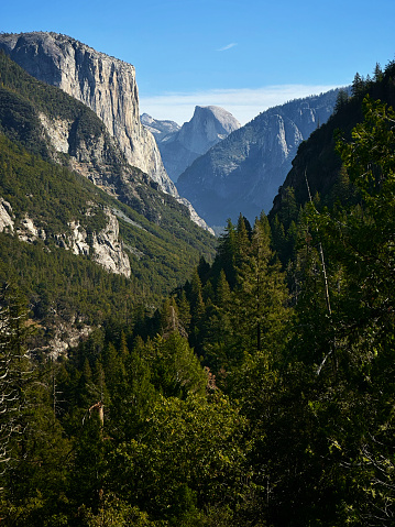Medium shot of Yosemite's El Capitan and Half Dome from a vantage point different from the standard tunnel view