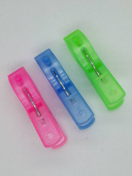 istock Three clothespin in pink, blue and green colour isolated on white background 1441783806