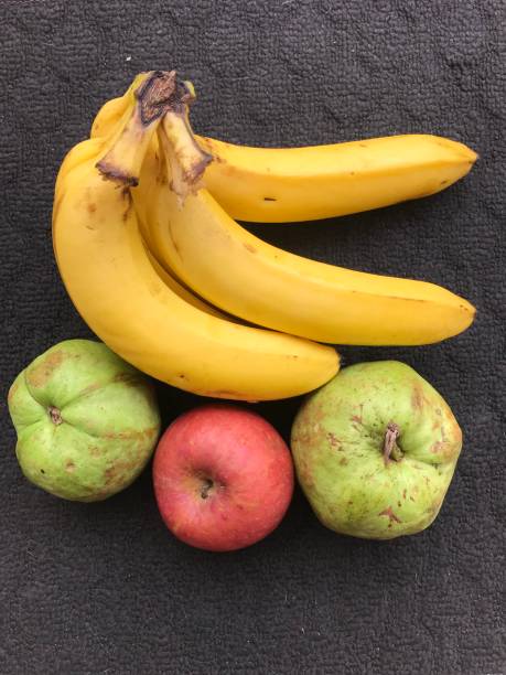 istock one bunch of bananas, two guavas and 1 apple 1441784391