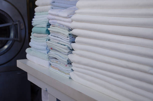 istock Stack of  freshly ironed sheets or fabrics in an industrial laundry. 1441786075
