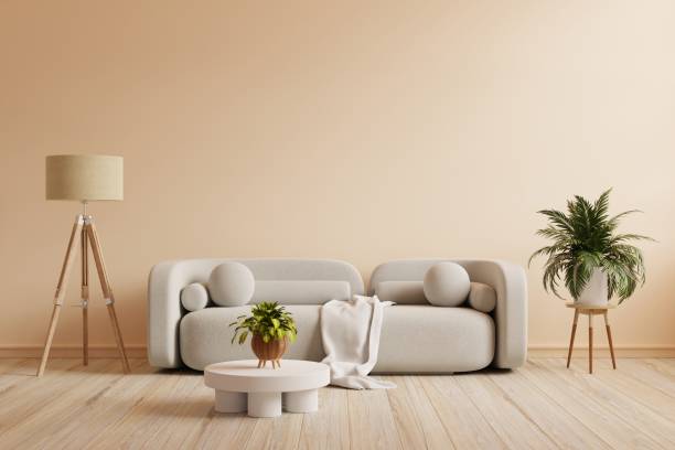 istock Boho style interior with gray sofa and decor on cream color wall. 1441791454