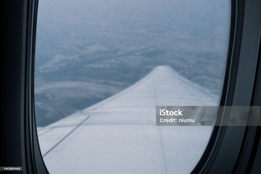 Looking out of the window of the plane Aerial View Stock Photo