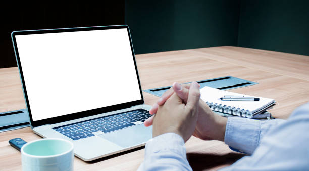 istock Businessman hands clasped together and white screen background mock up on display laptop with clipping path 1441804951
