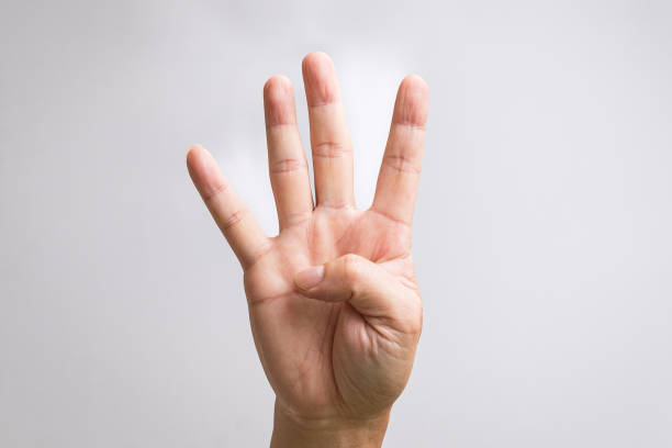 istock Hand showing four fingers. 1441813243