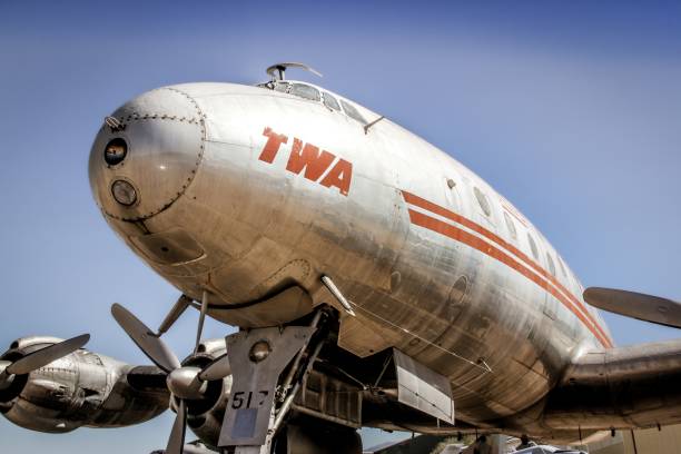 Propeller blades of a vintage aircraft against a cloud filled sky