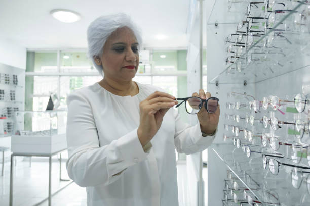 istock Woman trying new eyeglasses frame. 1441818060