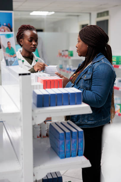 istock African american pharmacy assistant explaining buyer vitamins instruction 1441824629