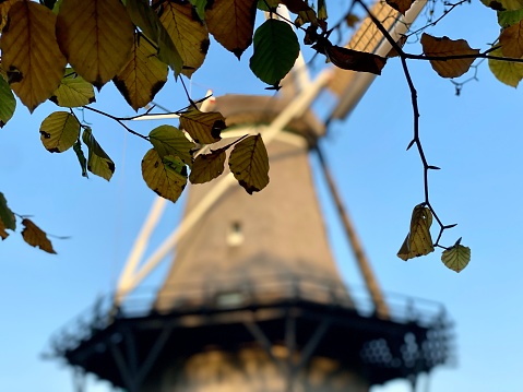 Dutch restored windmill through window in function