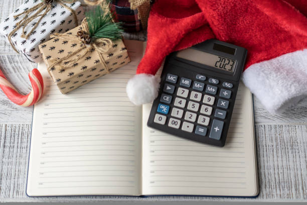 istock New Year's layout with calculator, Santa's hat and Christmas decorations 1441828242