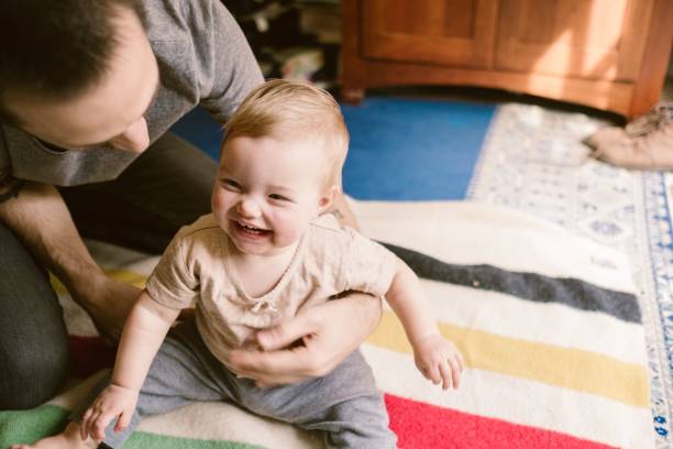 istock Father and daughter playing together at home 1441830088