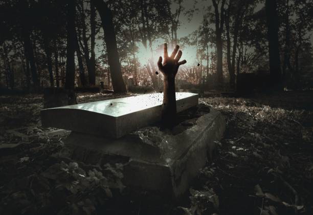 A hand rising out from the grave
