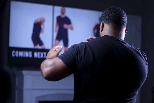 istock Young African American guy working out at home 1441831470