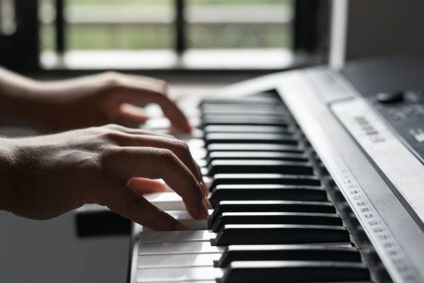 istock Selective focus shot of a Hispanic musician's hands playing the piano 1441831530