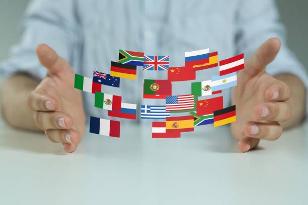istock Person presenting a virtual projection of flags of different countries tied with network 1441833122